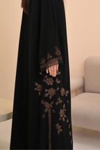 Black abaya with floral handwork on sleeves — Al Anood luxury collection
