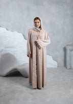 Modern modest abaya fashion in soft nude color