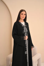 Black Nida abaya with floral embroidery and sheer panel — Al Anood UAE