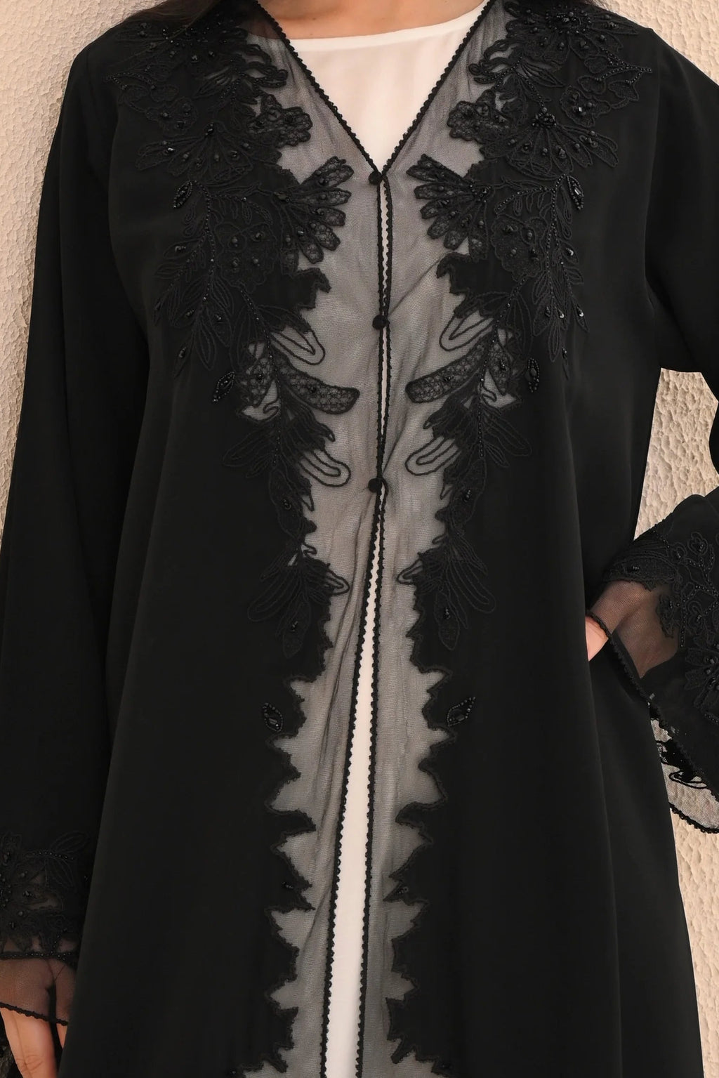 Black Nida abaya with floral embroidery and sheer panel — Al Anood UAE