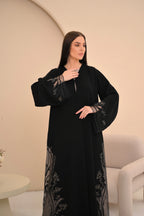 Black Nida abaya with sheer embroidered hem panels — Al Anood UAE