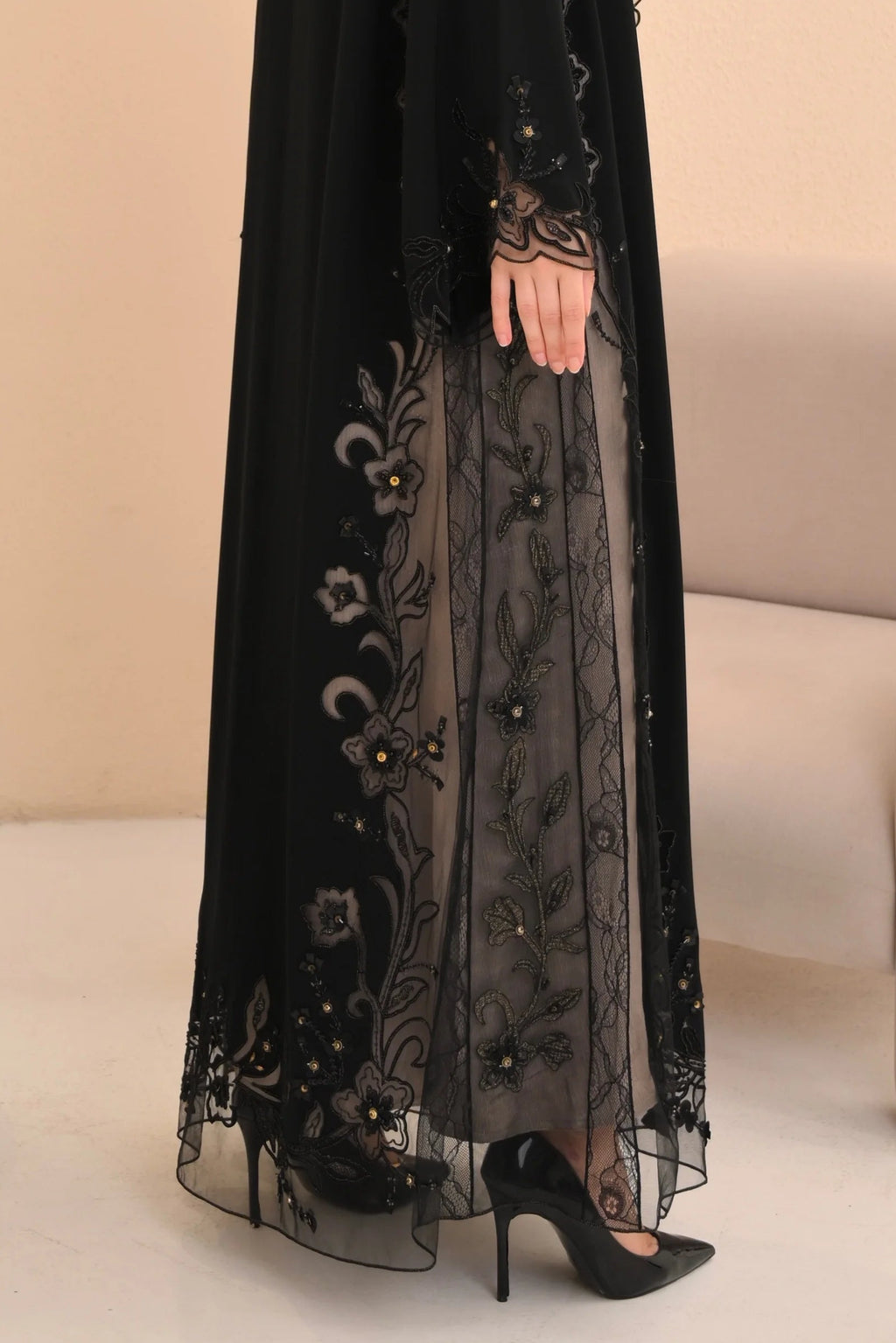 Black abaya back view — flowing sheer hem with floral computer embroidery Al Anood