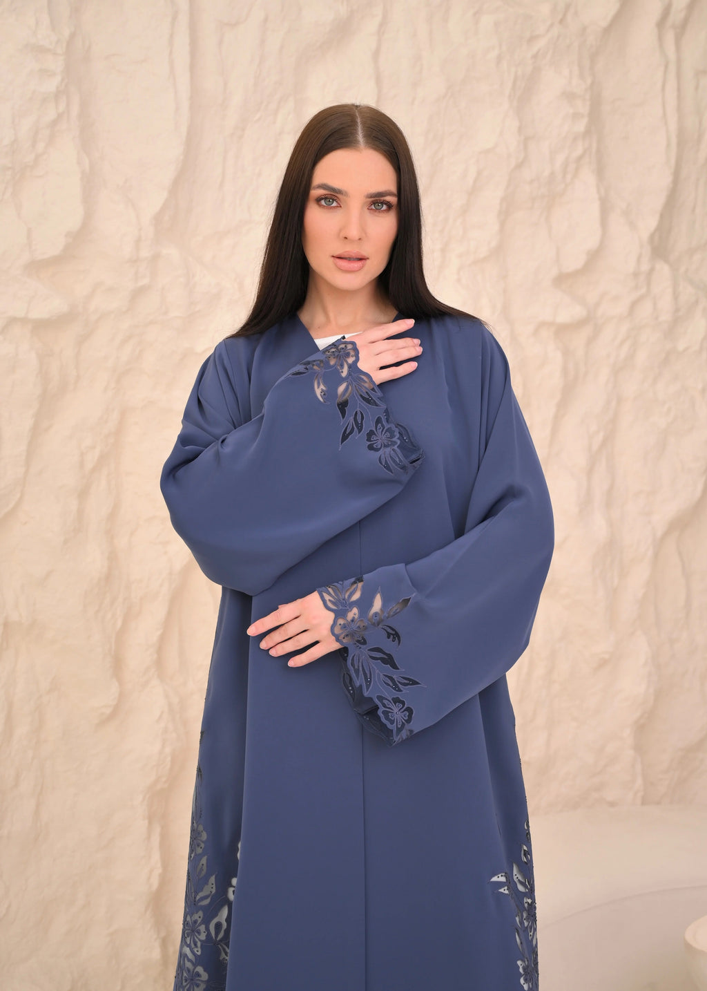 Blue abaya seated view — full-length floral laser cut panel Al Anood UAE