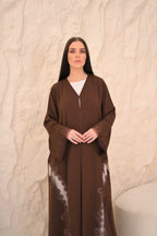 Brown Nida abaya with floral laser-cut hem panels — Al Anood UAE
