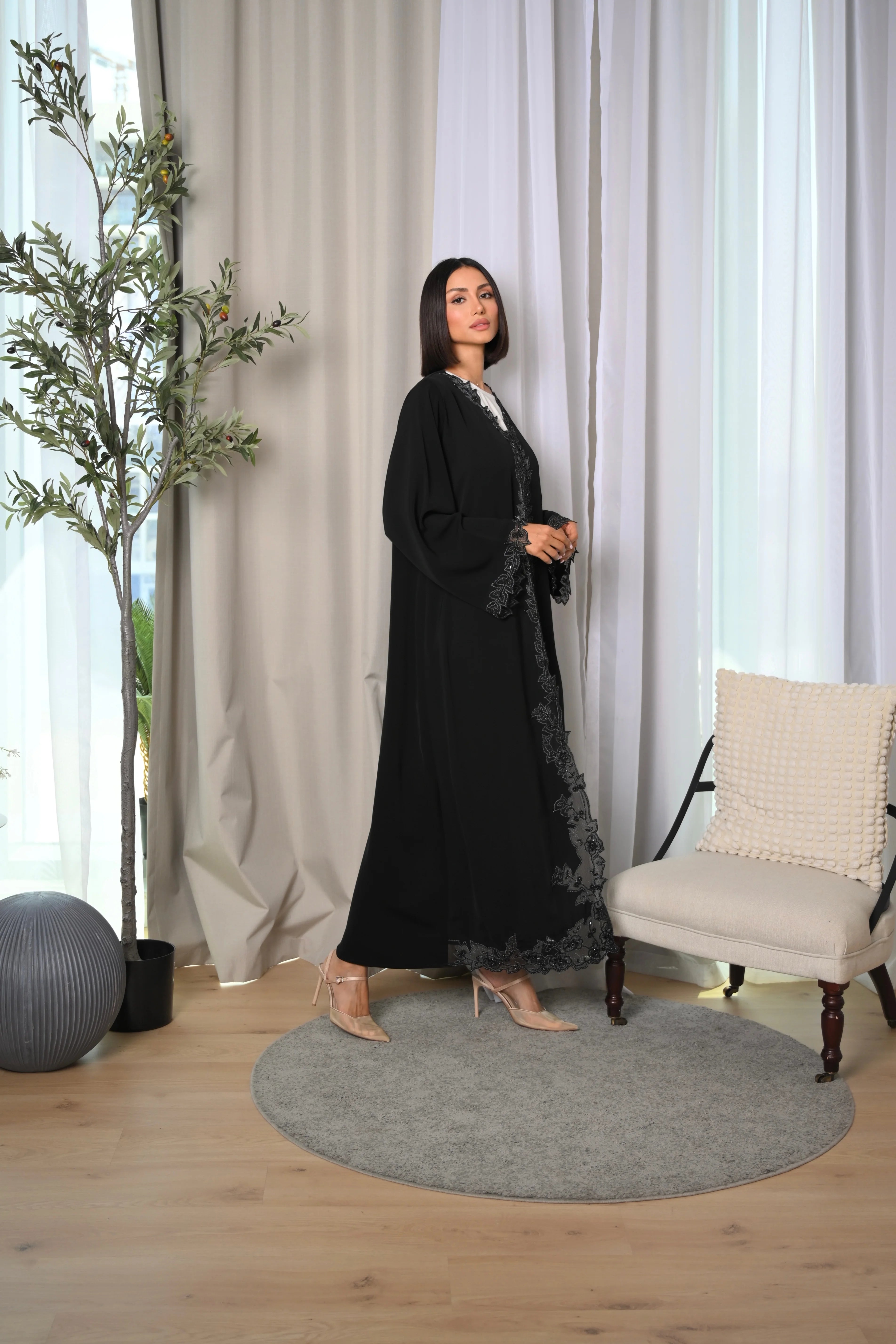 Elegant black abaya with laser cut details and hand embroidery