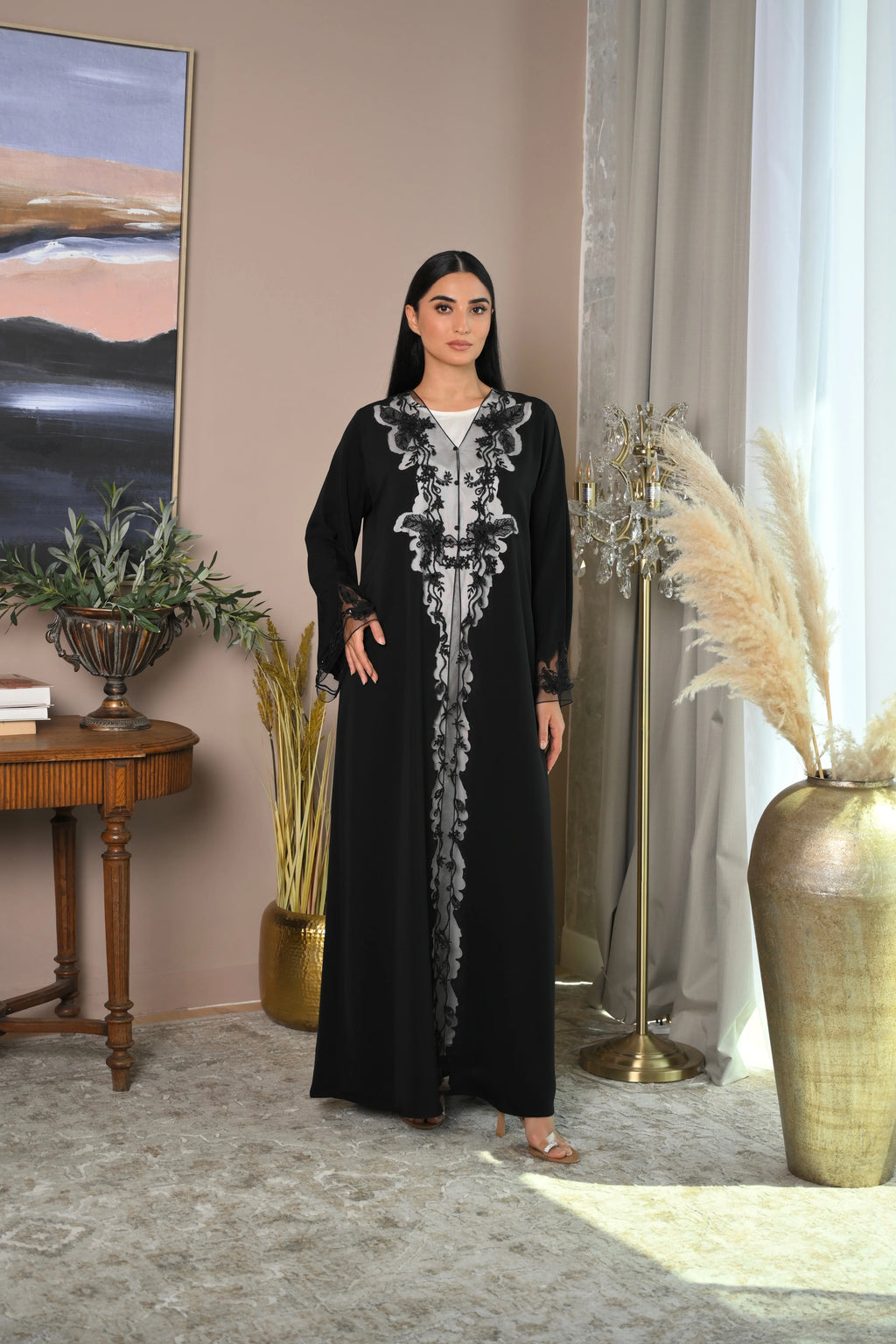 Black luxury Emirati abaya with laser detailing and elegant hand embroidery on chest and sleeves