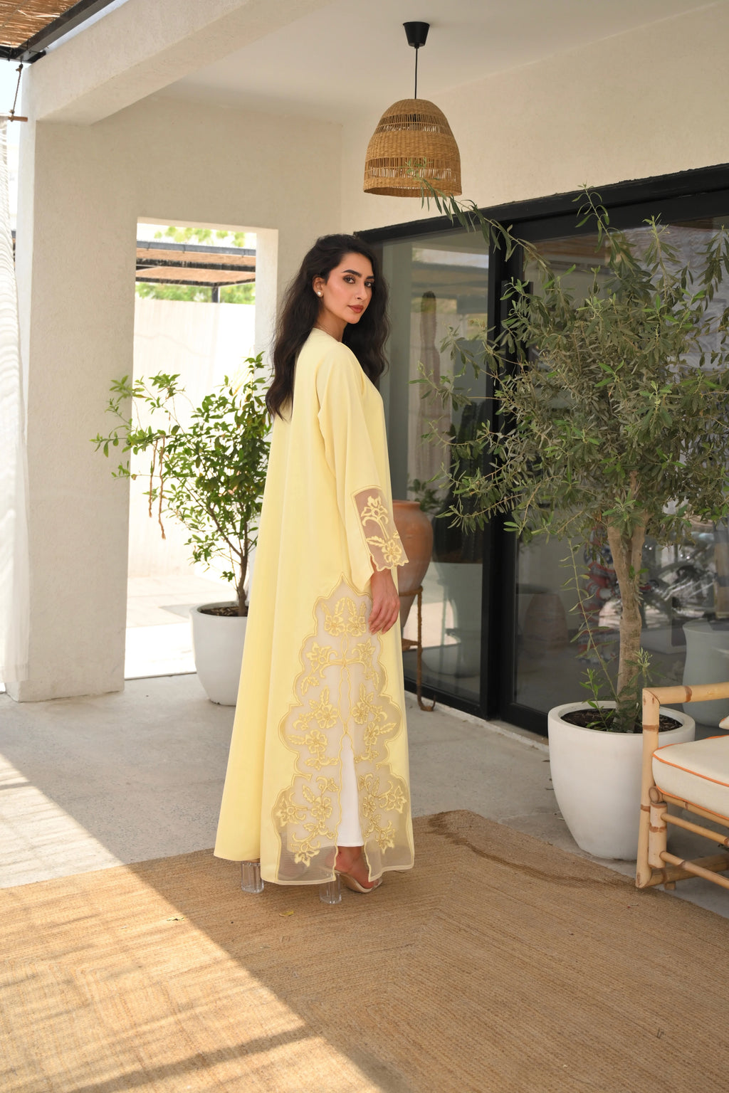 Light yellow Emirati abaya with laser cut details and Dori embroidery on sleeves and side panels