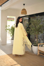 Light yellow Emirati abaya with laser cut details and Dori embroidery on sleeves and side panels