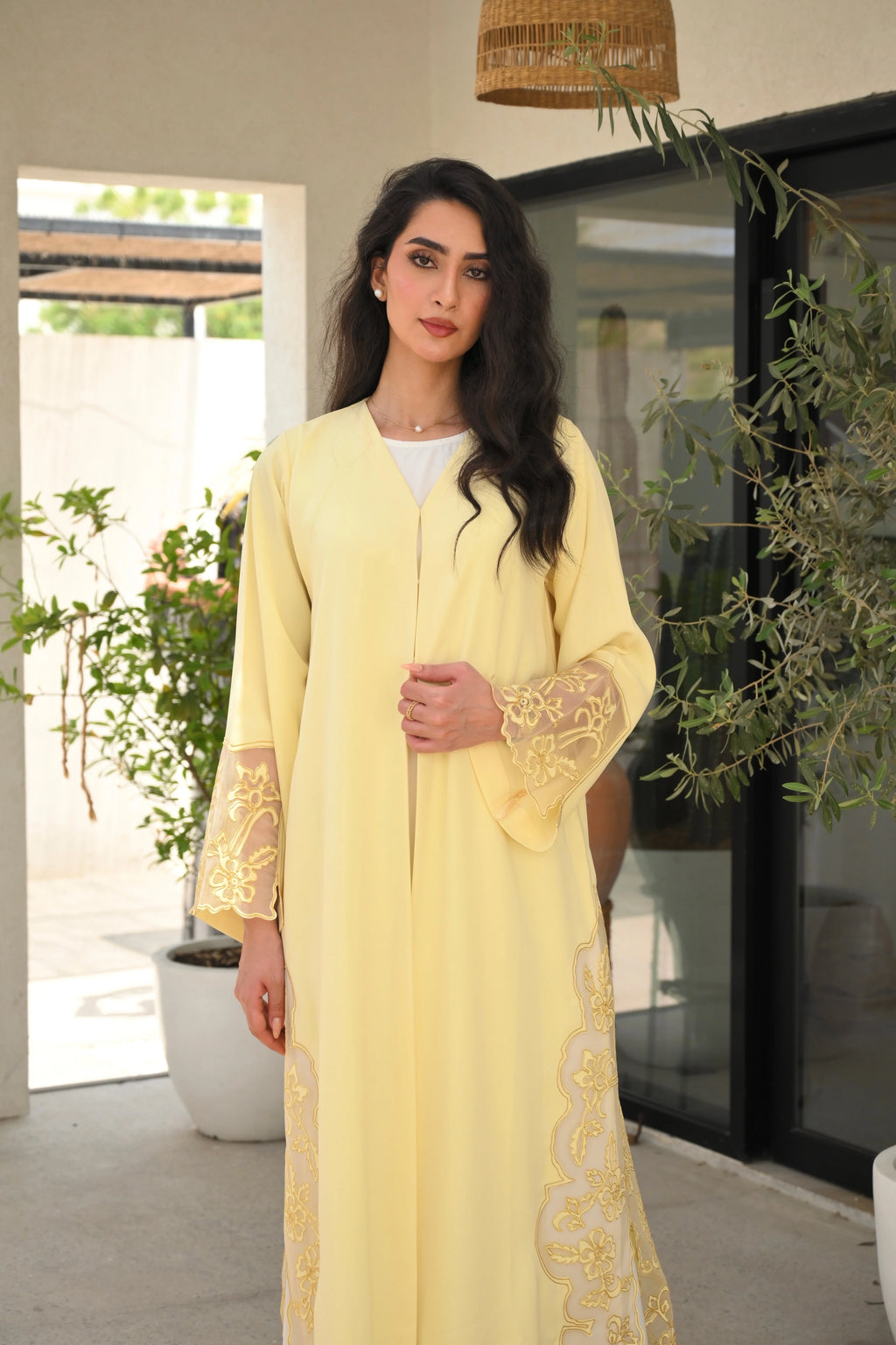Light yellow Emirati abaya with laser cut details and Dori embroidery on sleeves and side panels