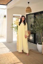 Light yellow Emirati abaya with laser cut details and Dori embroidery on sleeves and side panels