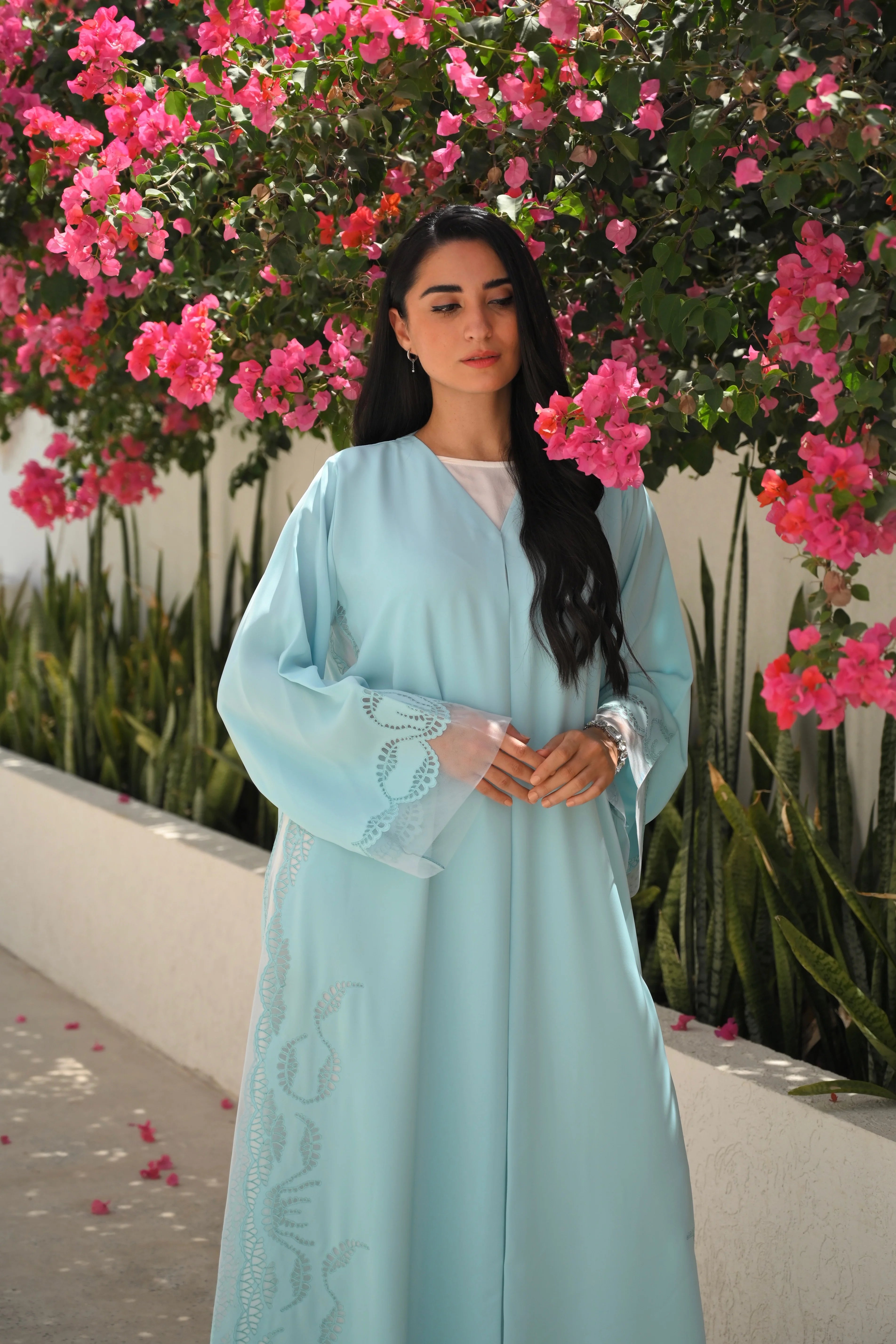 Light blue Emirati abaya with laser cut embroidery on sleeves and side panels
