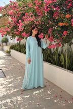 Light blue Emirati abaya with laser cut embroidery on sleeves and side panels