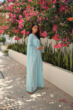 Light blue Emirati abaya with laser cut embroidery on sleeves and side panels