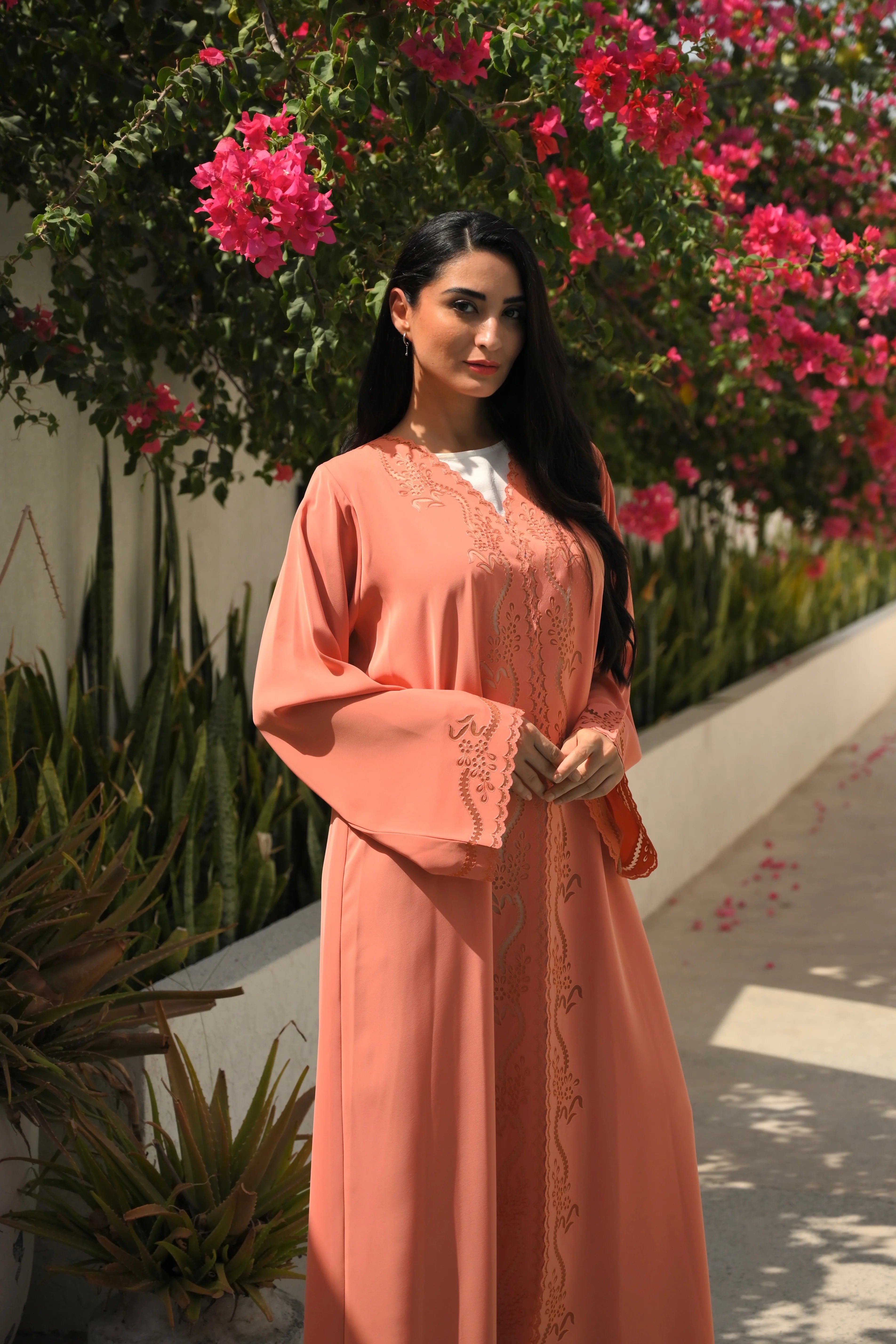 Luxury coral pink Emirati abaya with laser cut details and Aari embroidery