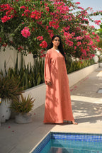 Luxury coral pink Emirati abaya with laser cut details and Aari embroidery
