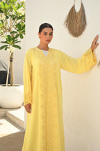 Luxury yellow Emirati abaya with laser cut embroidery on front panel and sleeves