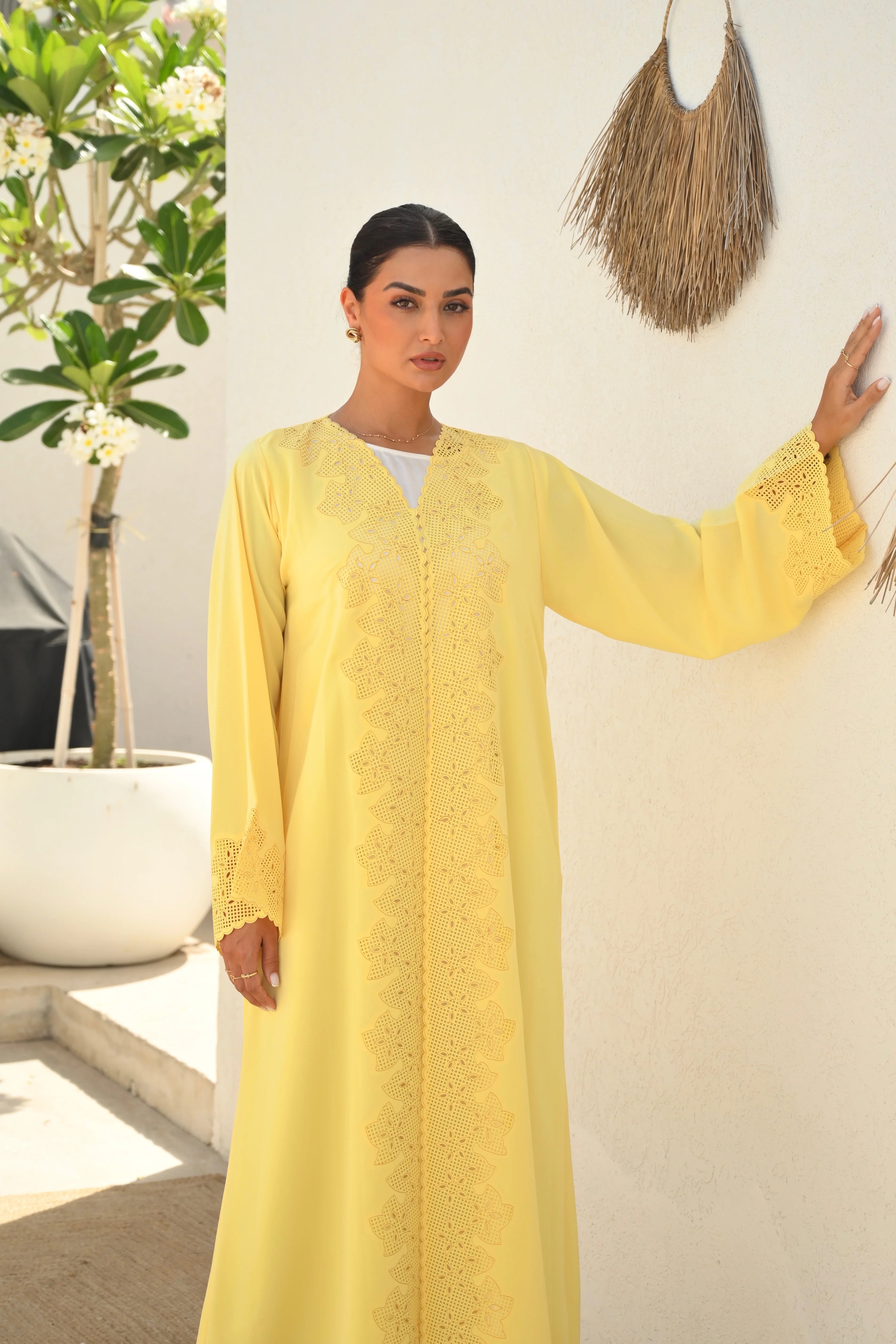 Luxury yellow Emirati abaya with laser cut embroidery on front panel and sleeves