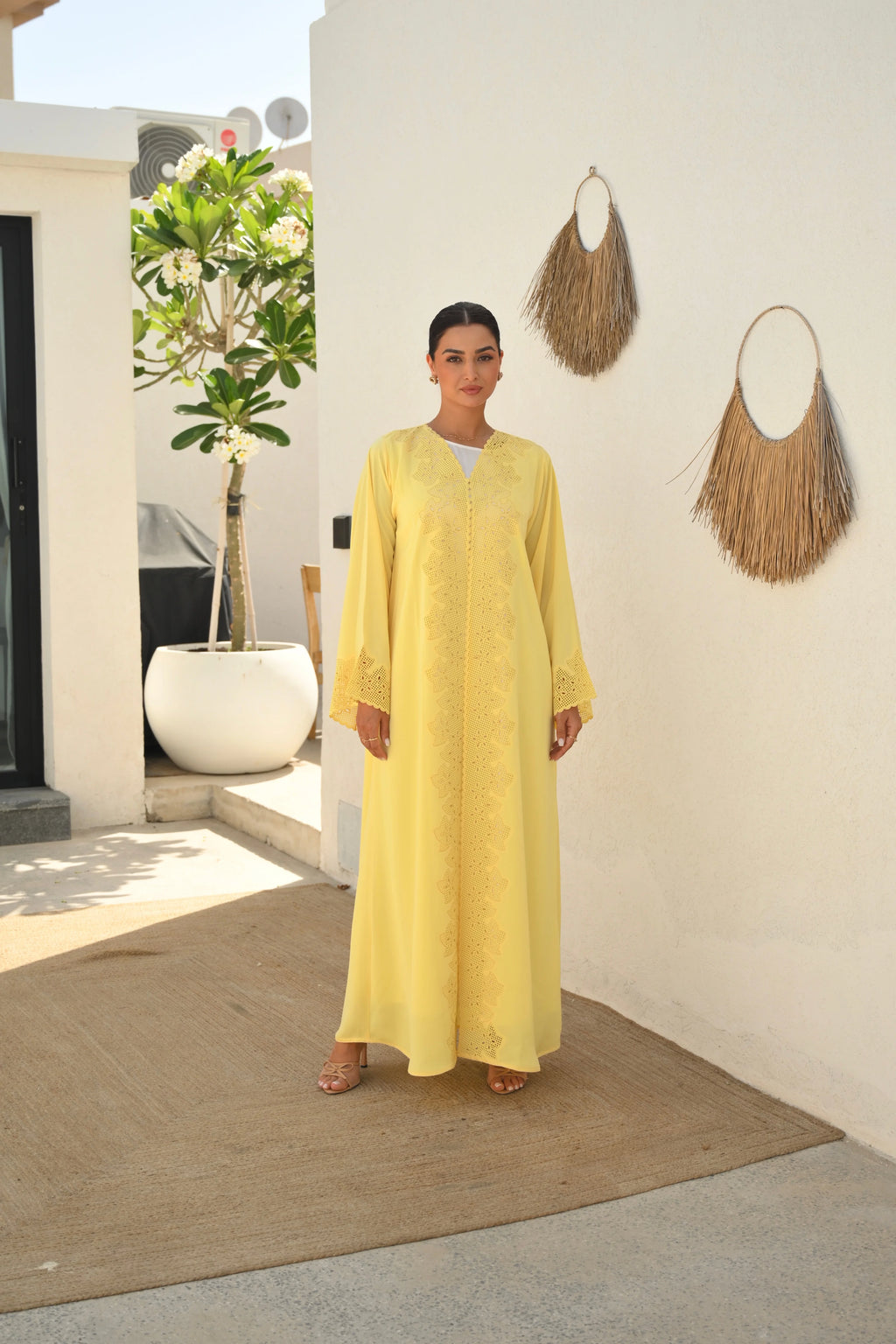 Luxury yellow Emirati abaya with laser cut embroidery on front panel and sleeves