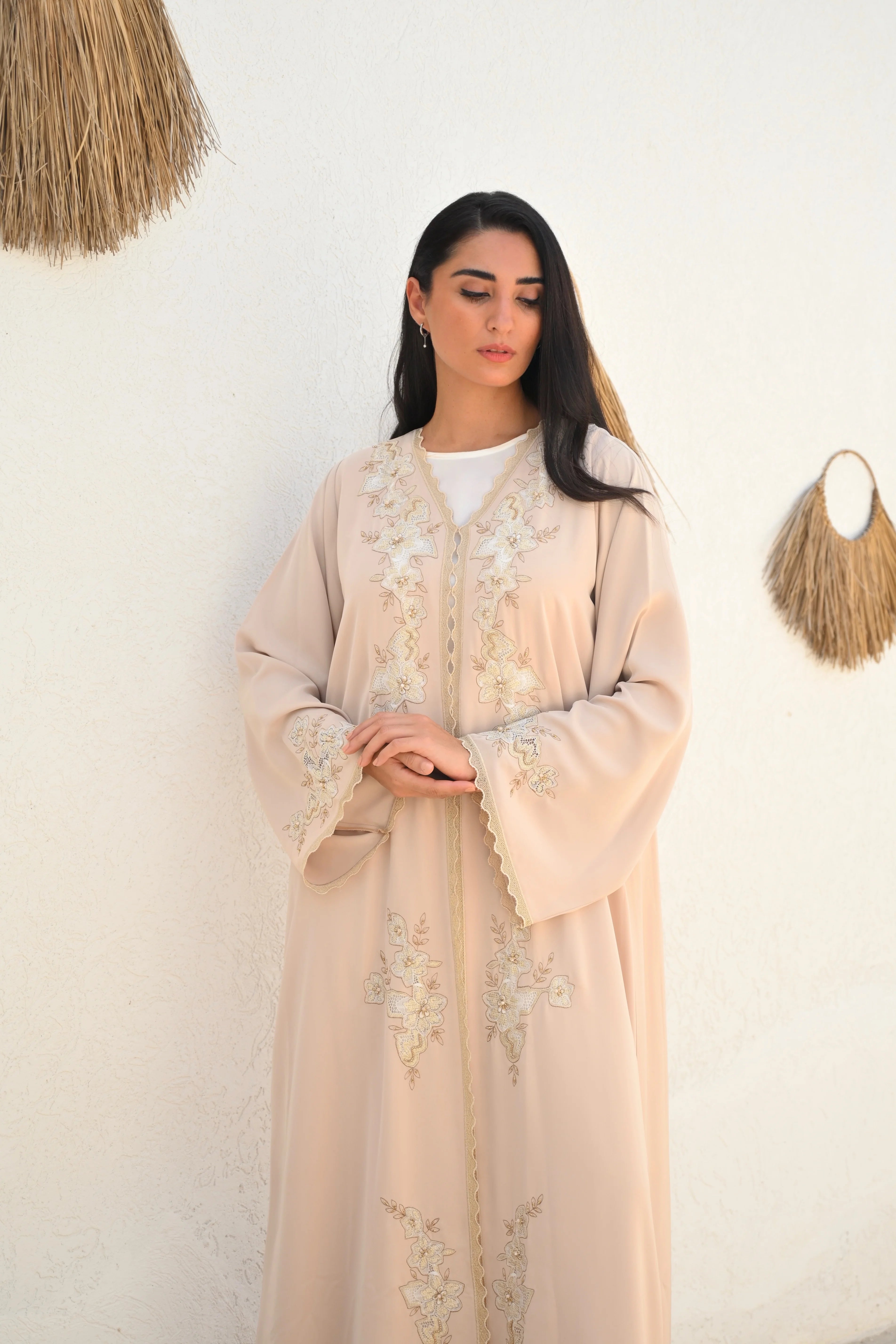 Soft beige Emirati abaya with laser embroidery on the chest and sleeves