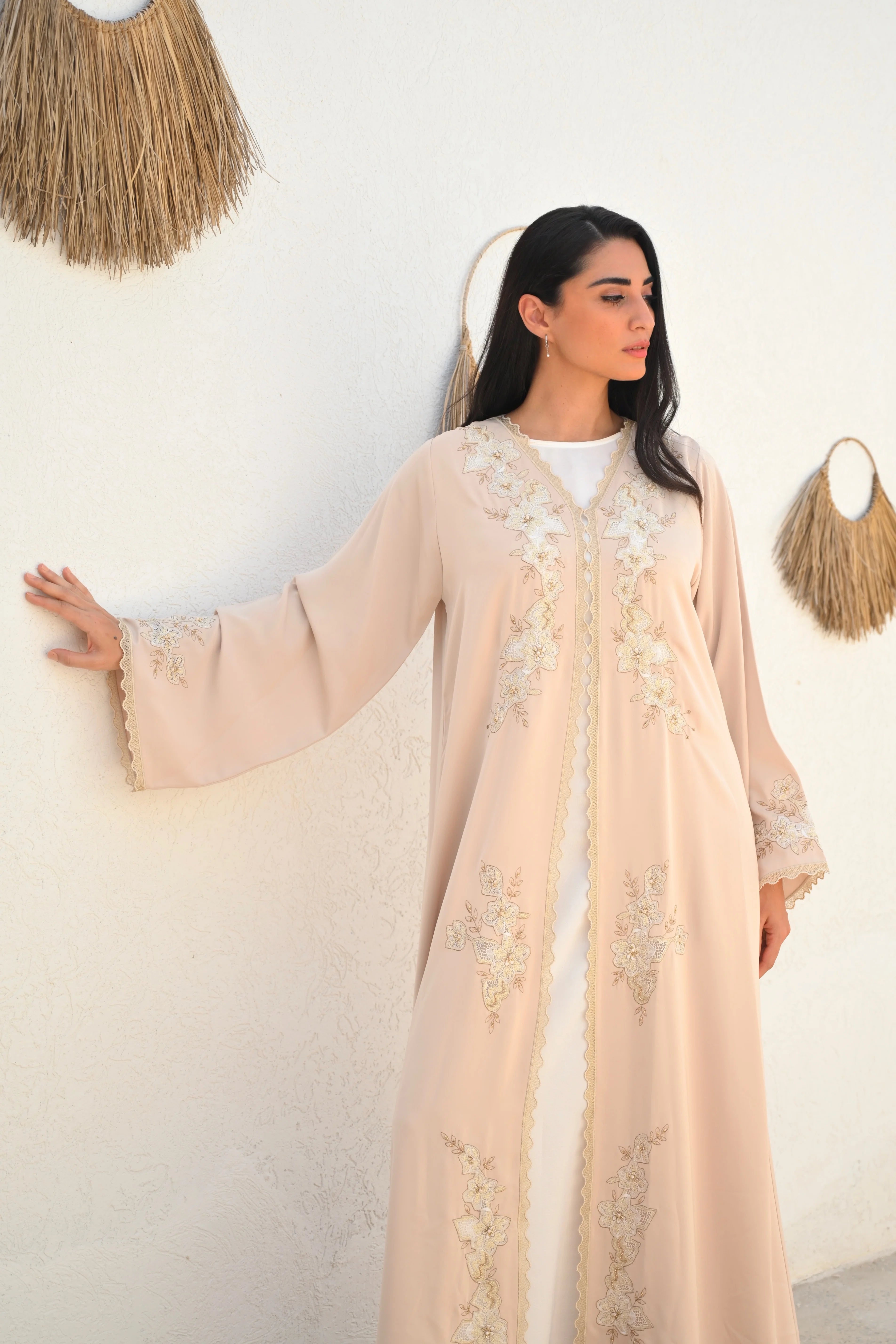 Soft beige Emirati abaya with laser embroidery on the chest and sleeves