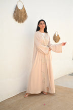 Soft beige Emirati abaya with laser embroidery on the chest and sleeves