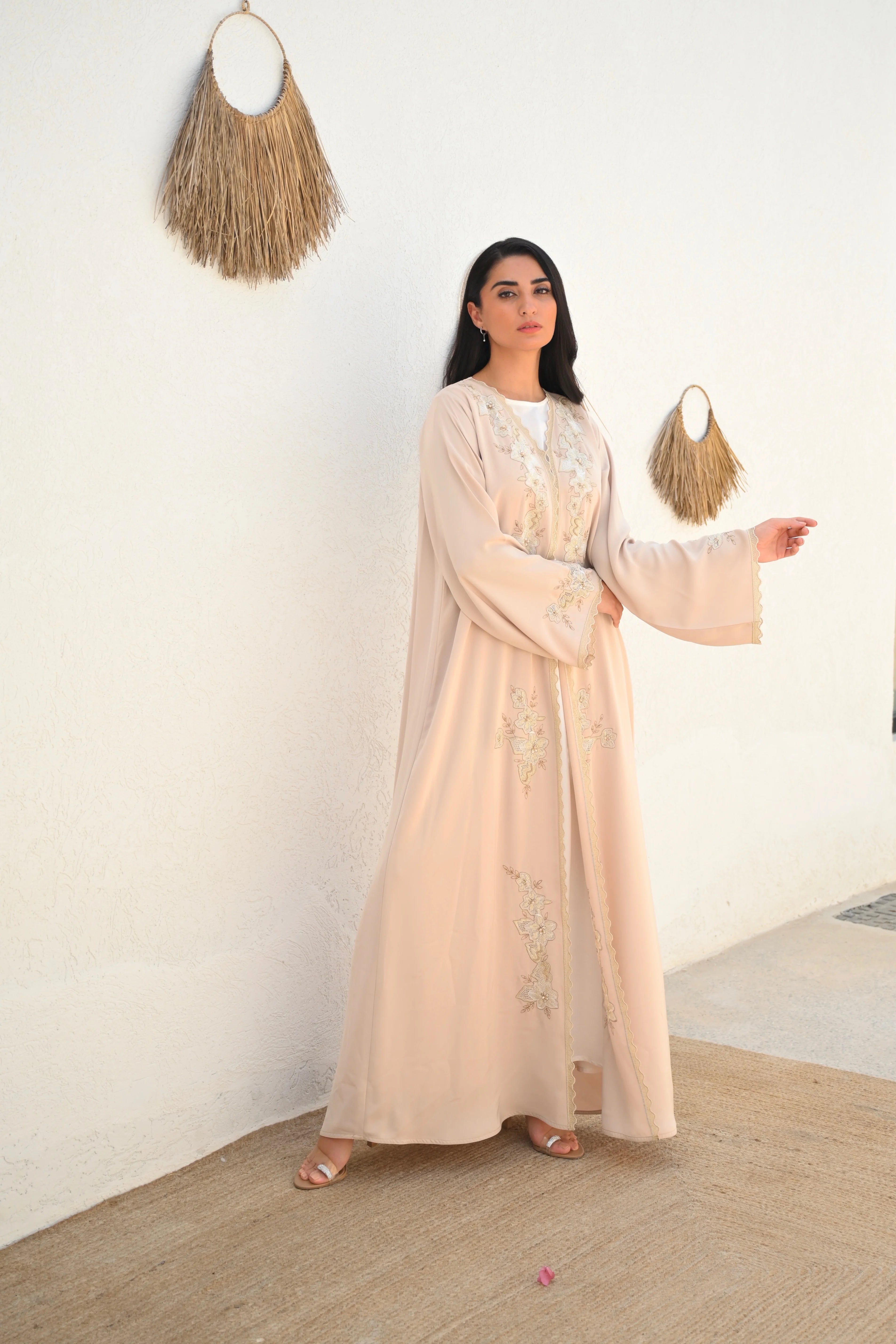 Soft beige Emirati abaya with laser embroidery on the chest and sleeves