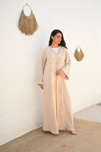 Soft beige Emirati abaya with laser embroidery on the chest and sleeves