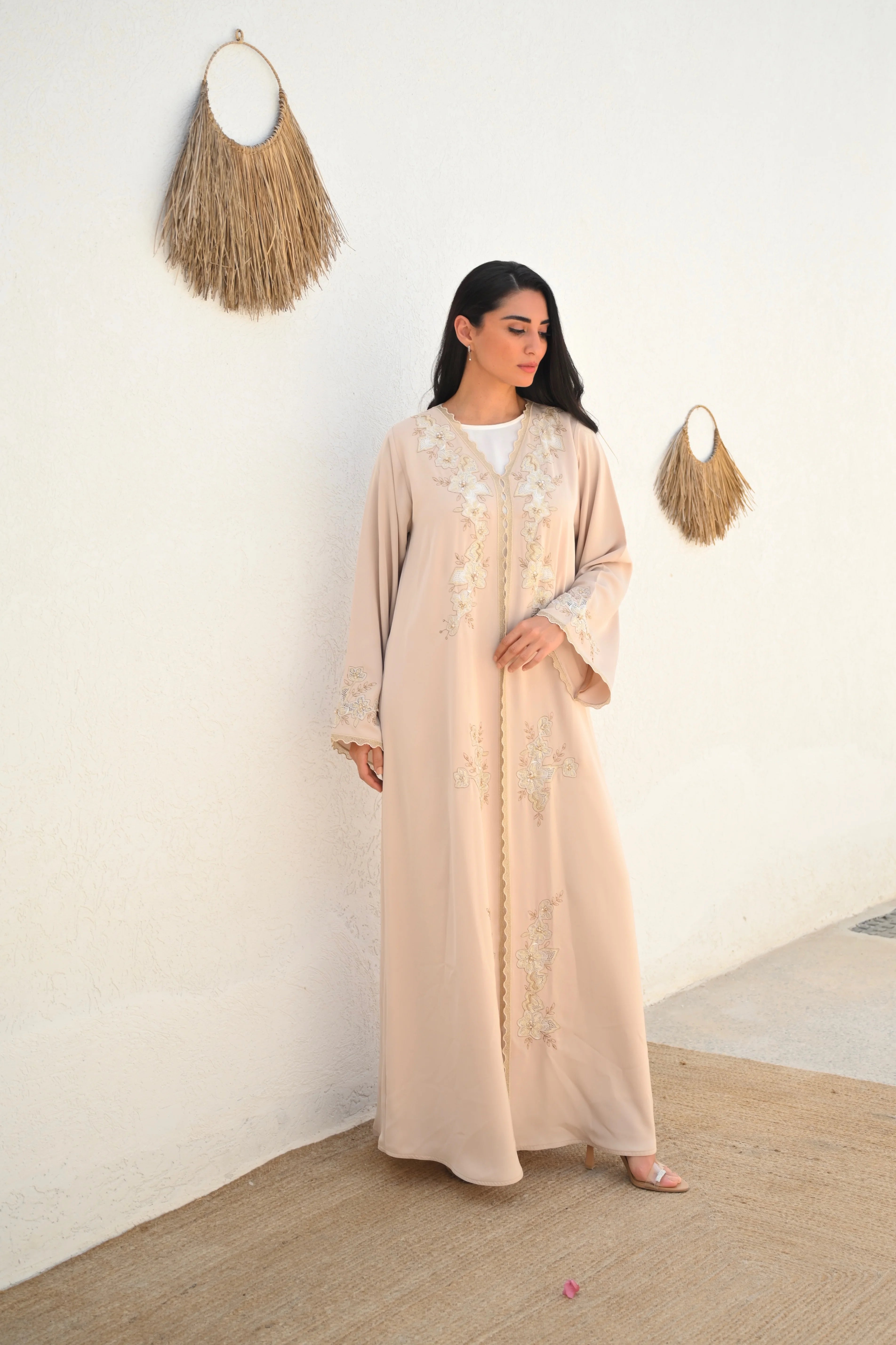 Soft beige Emirati abaya with laser embroidery on the chest and sleeves