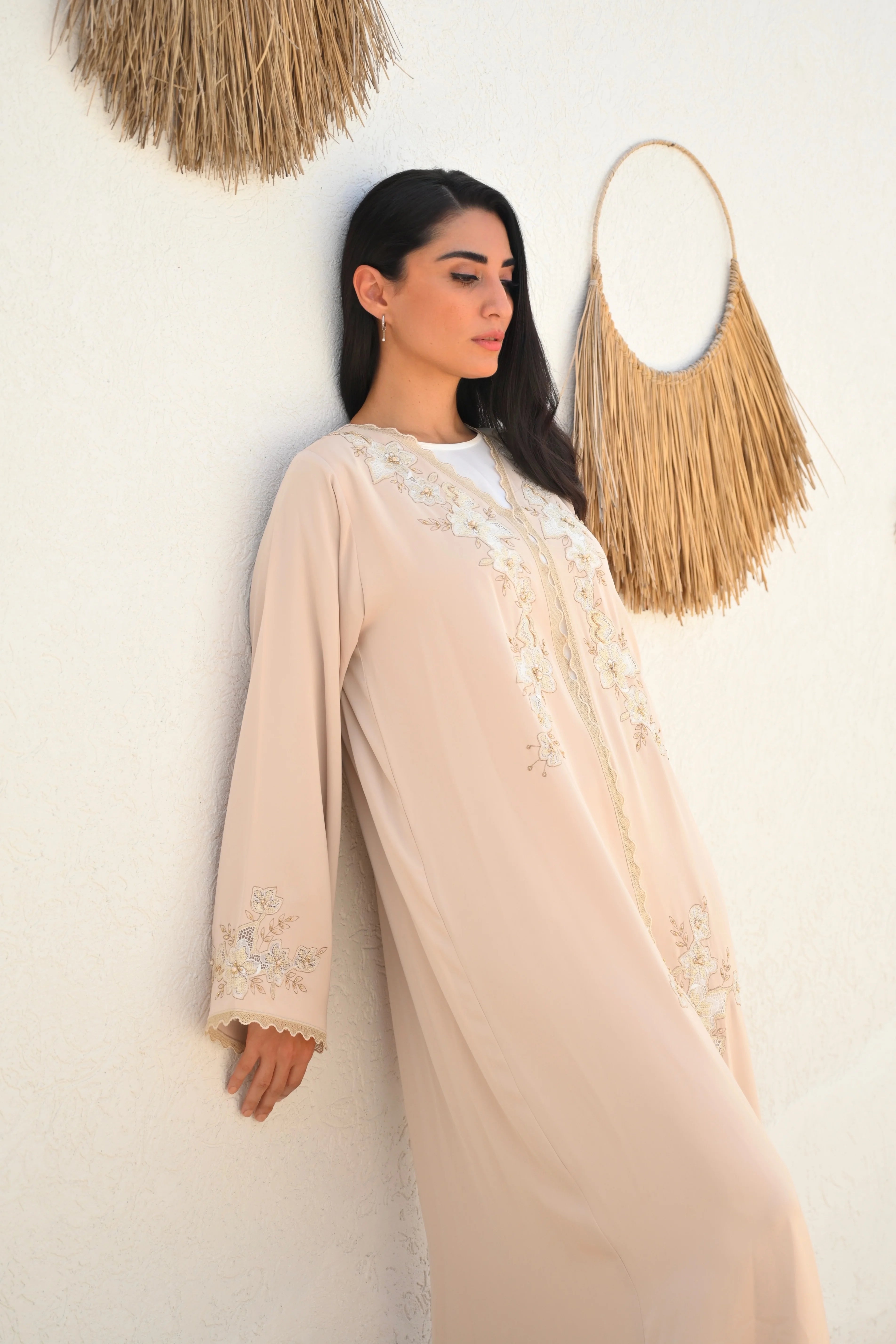Soft beige Emirati abaya with laser embroidery on the chest and sleeves