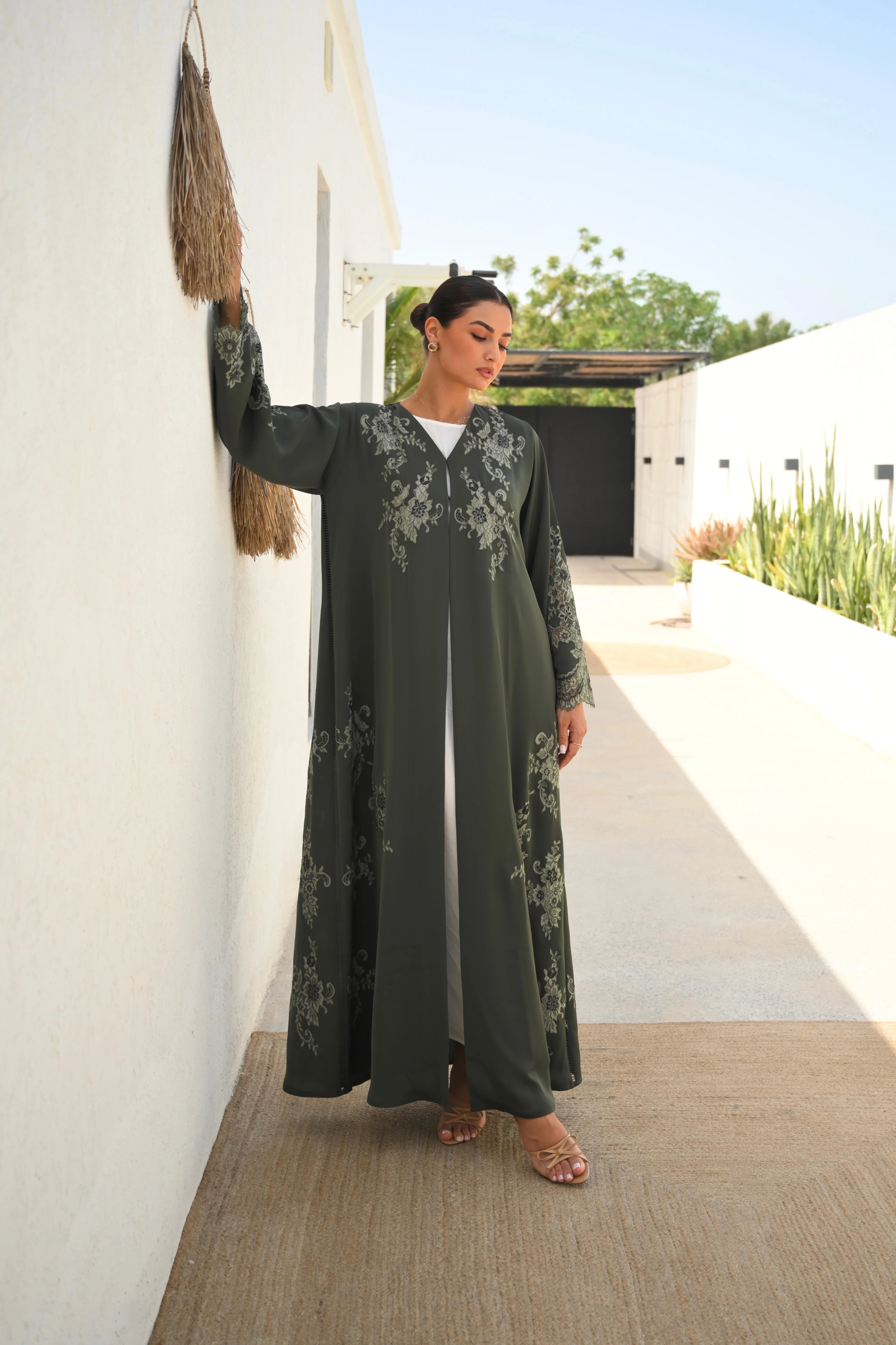 Luxury olive green Nida abaya with embroidery and lace detailing on chest, sleeves and sides