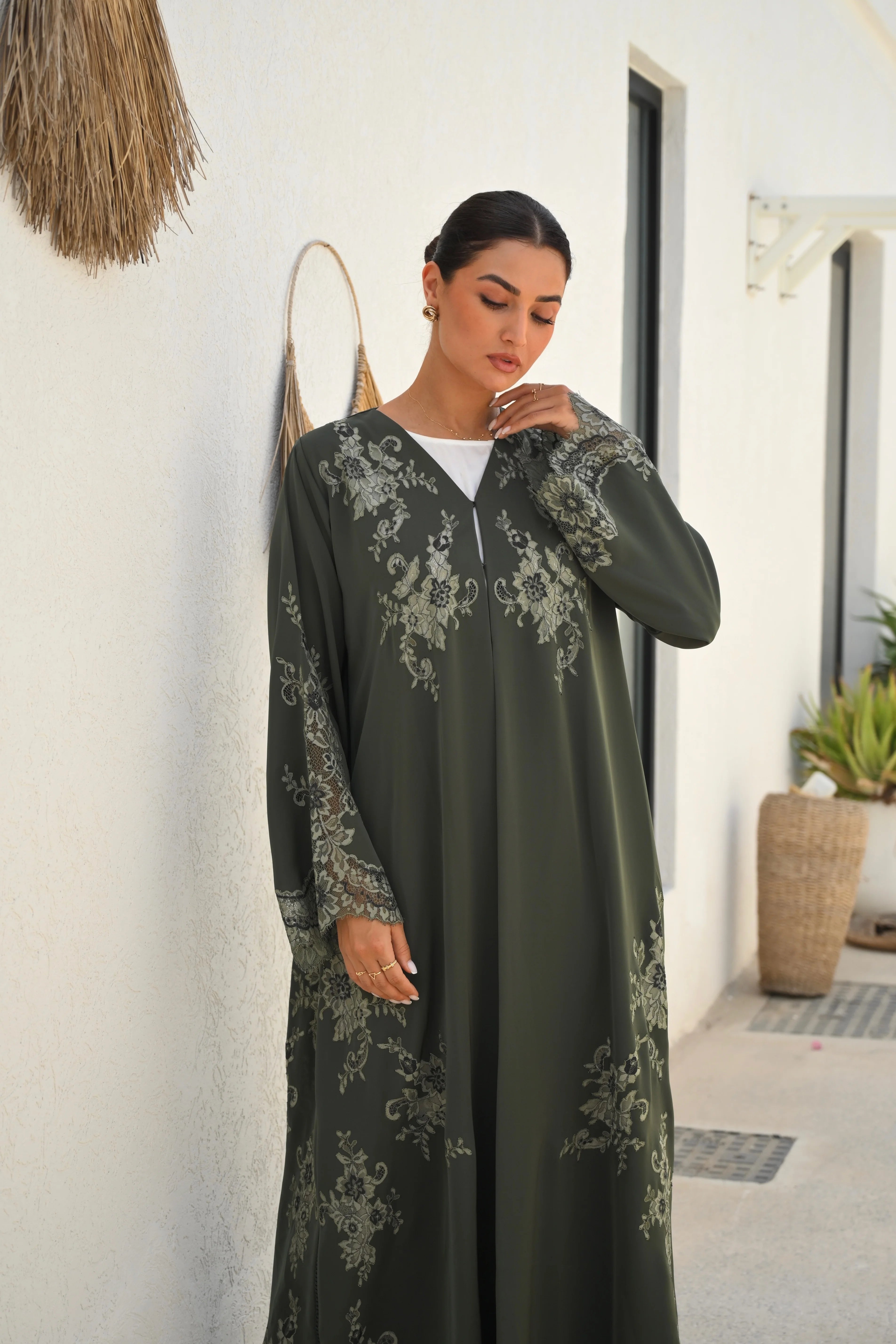 Luxury olive green Nida abaya with embroidery and lace detailing on chest, sleeves and sides