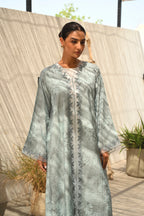 Luxury turquoise tie-dye abaya with elegant Dori embroidery and laser-cut details on the front and sleeves