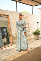 Luxury turquoise tie-dye abaya with elegant Dori embroidery and laser-cut details on the front and sleeves