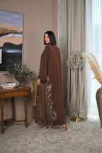 Brown Emirati abaya with laser cut detailing, Dori embroidery and handwork on sleeves and sides, luxury modest fashion design