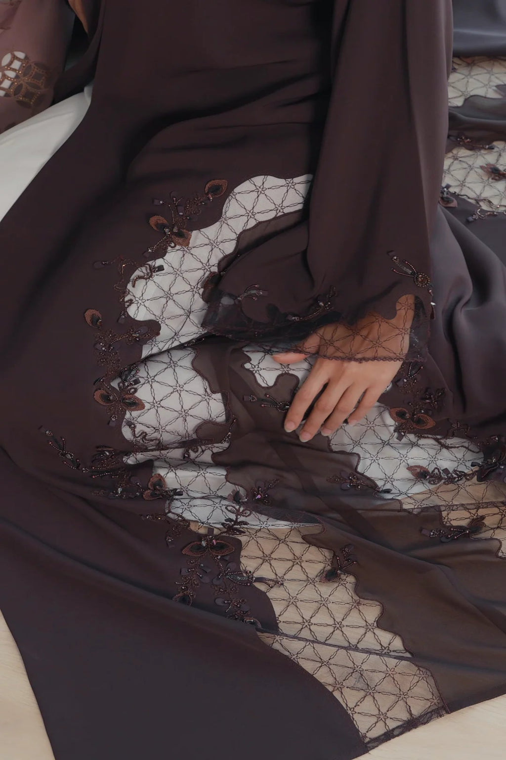 Luxury dark brown Emirati abaya with theatre embroidery and transparent handwork detailing on sleeves and sides