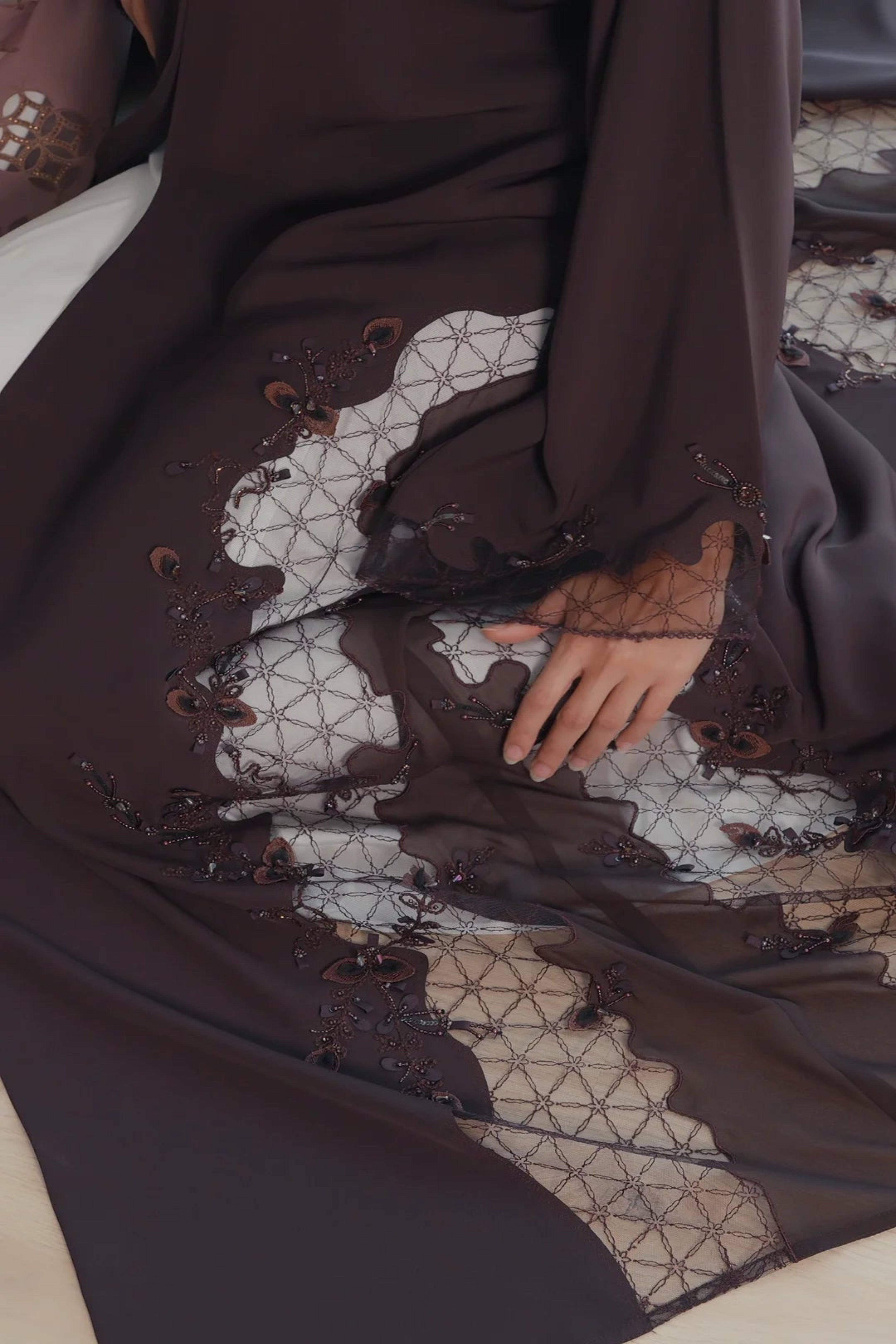 Luxury dark brown Emirati abaya with theatre embroidery and transparent handwork detailing on sleeves and sides