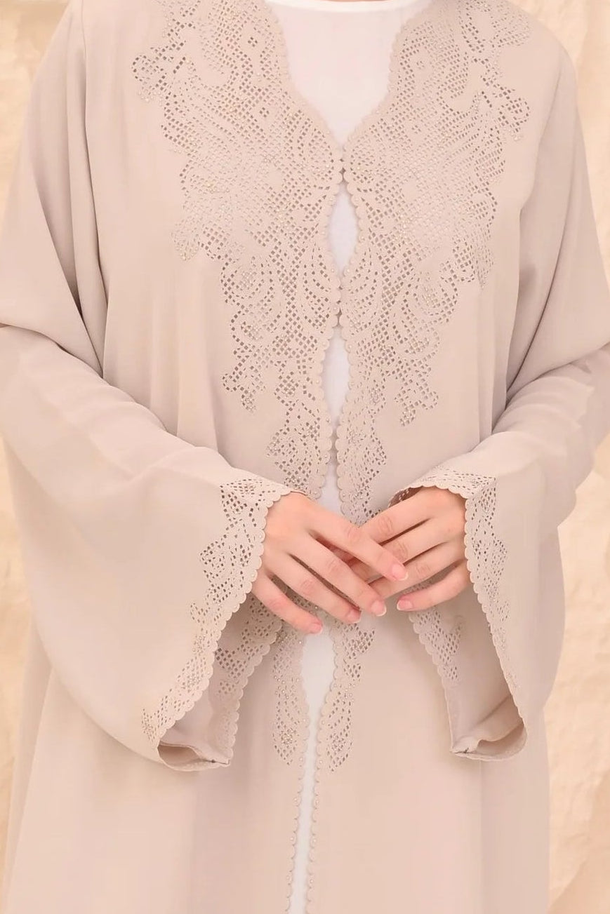 Elegant beige abaya front view — laser-cut detail and crystal Al Anood UAE