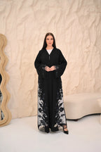 Elegant black Nida abaya with floral Dori handwork and sheer panels — Al Anood UAE
