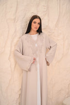 Hand embroidery and crystal close-up beige Nida abaya — Al Anood UAE