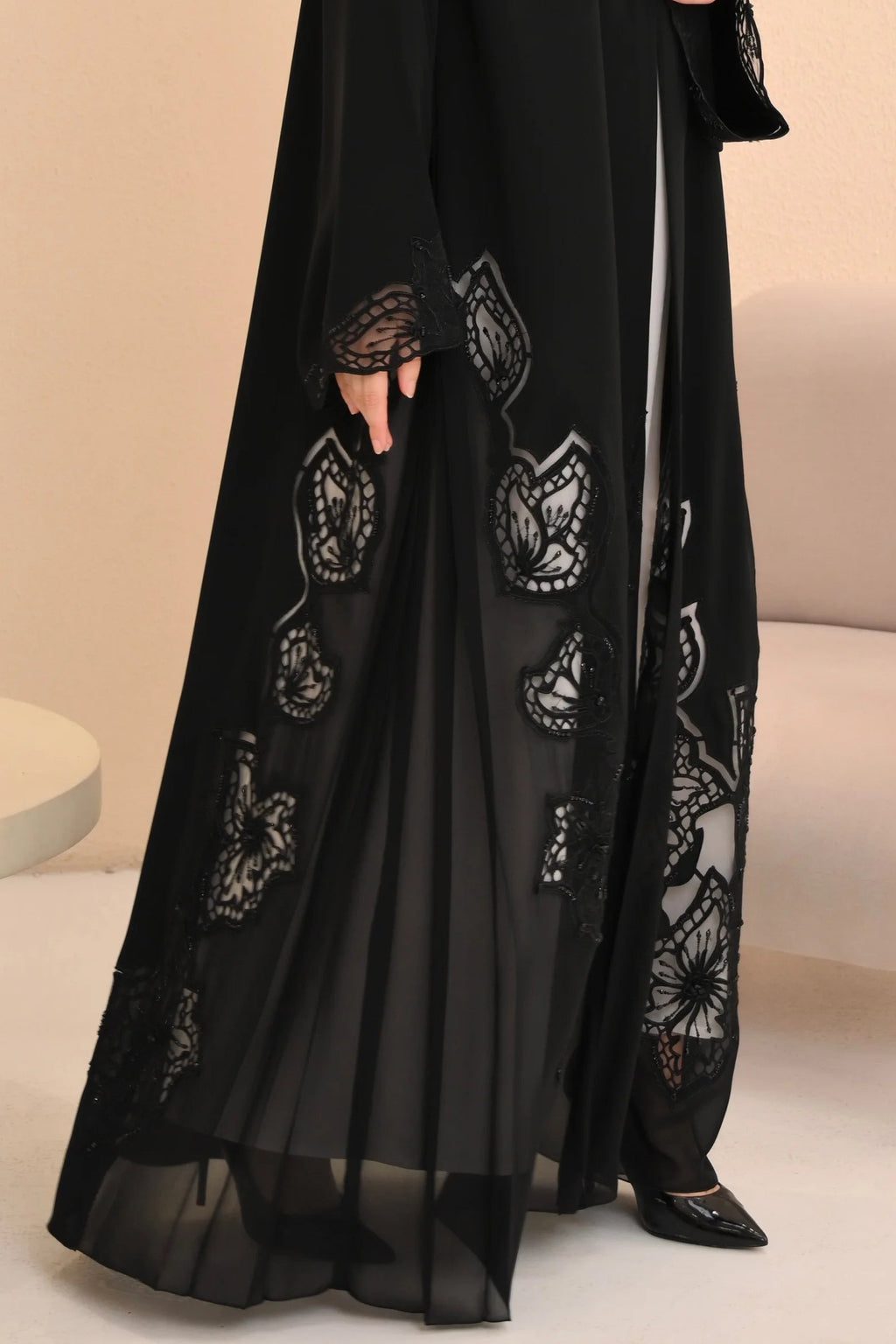 Laser-cut hem close-up black Nida abaya — Al Anood luxury collection UAE