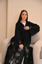 Luxury black abaya front view — bold geometric laser cut panels Al Anood UAE
