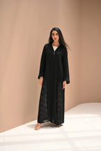Black Nida abaya featuring statement sleeves with laser-cut and handcrafted Dori details