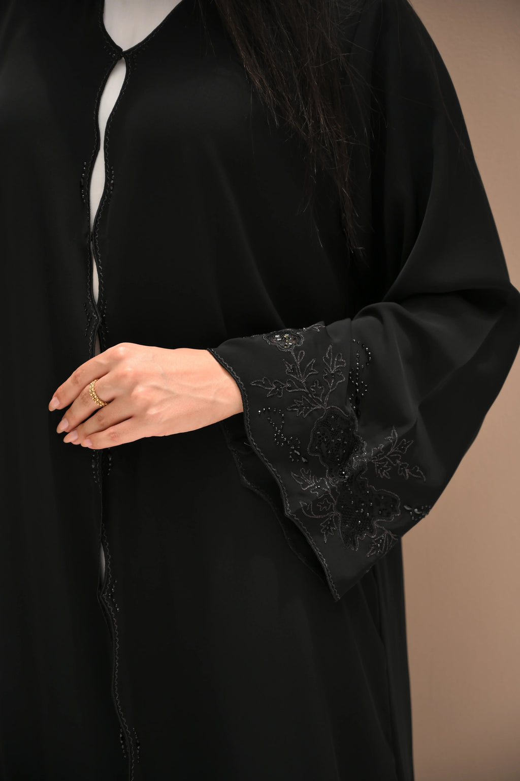 Black Nida abaya with hand embroidery and crystal detailing on sleeves and lower panels