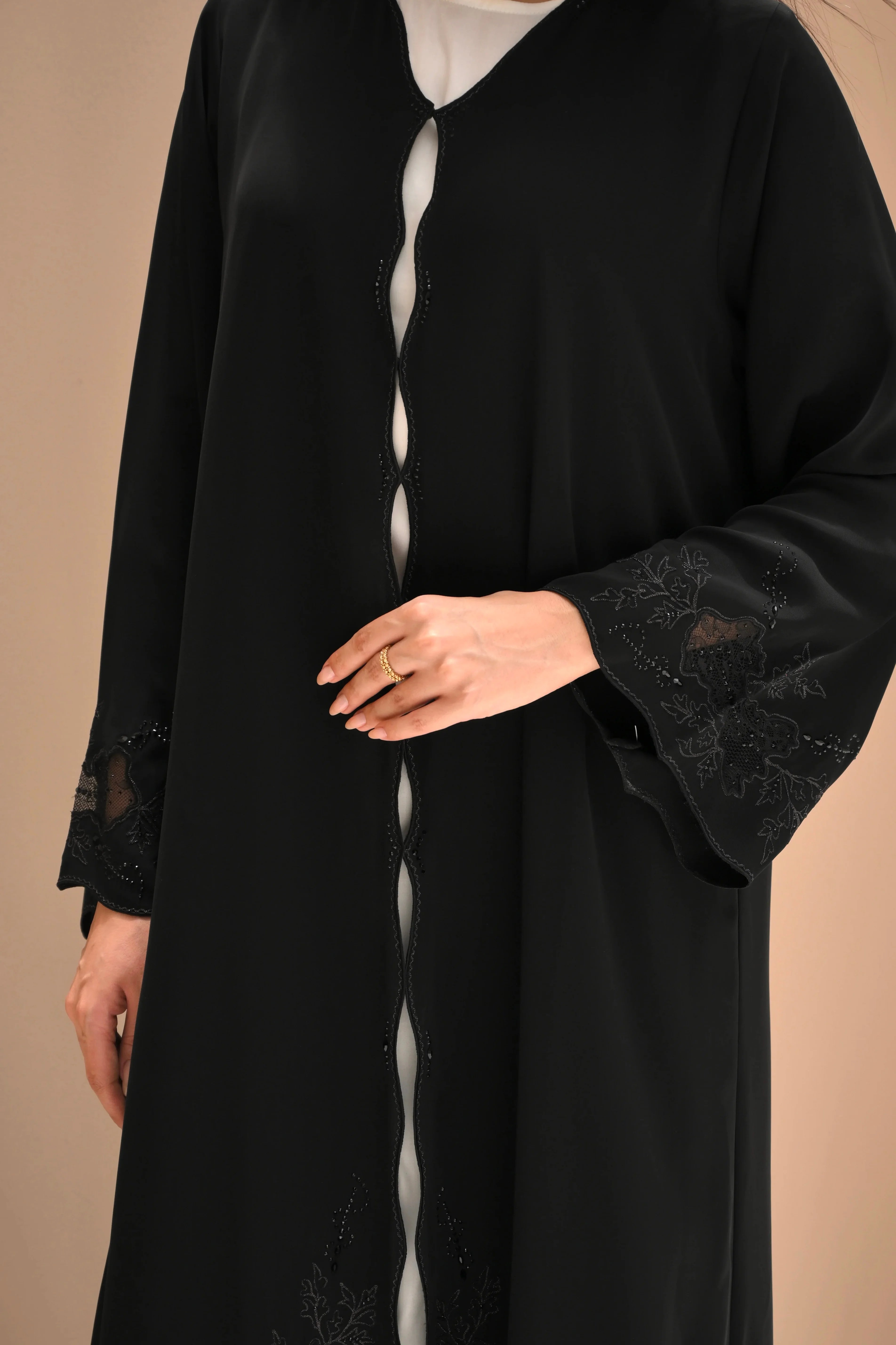 Black Nida abaya with hand embroidery and crystal detailing on sleeves and lower panels
