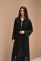 Black Nida abaya with hand embroidery and crystal detailing on sleeves and lower panels