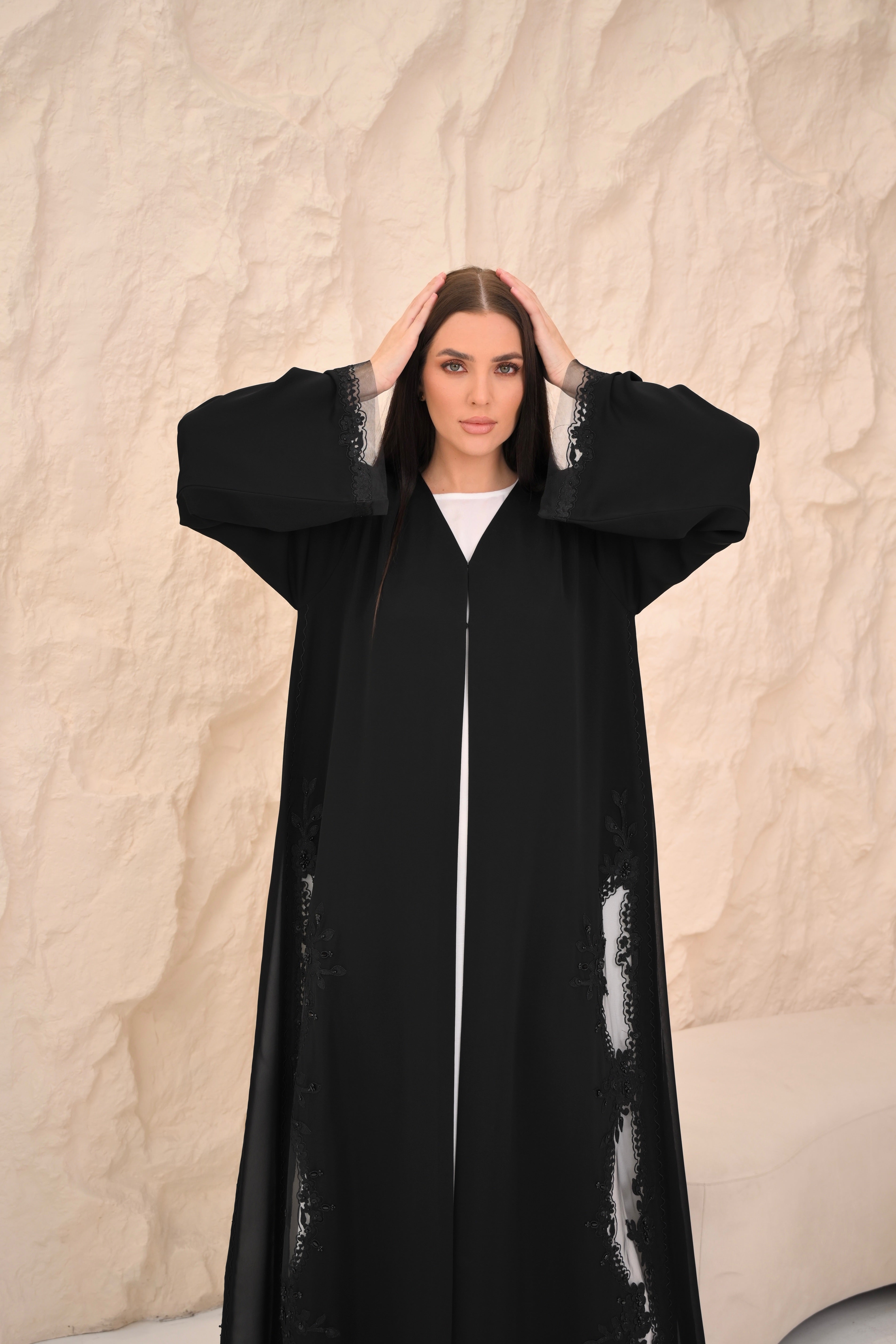Hand embroidery detail on chiffon hem — Al Anood black luxury abaya