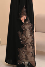 Black abaya back view — dramatic sheer panel with crystal handwork Al Anood