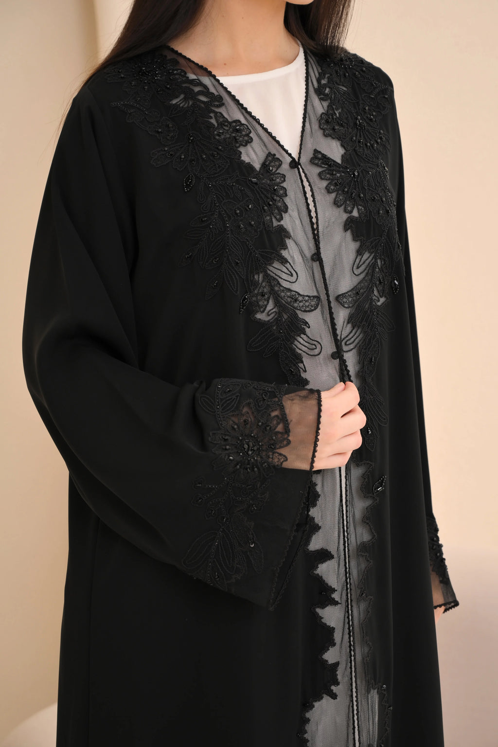Elegant black abaya front view — floral embroidery and picot trim Al Anood