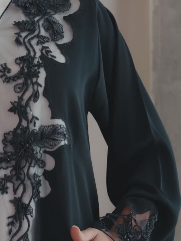 Black luxury Emirati abaya with laser detailing and elegant hand embroidery on chest and sleeves
