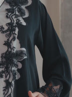Black luxury Emirati abaya with laser detailing and elegant hand embroidery on chest and sleeves